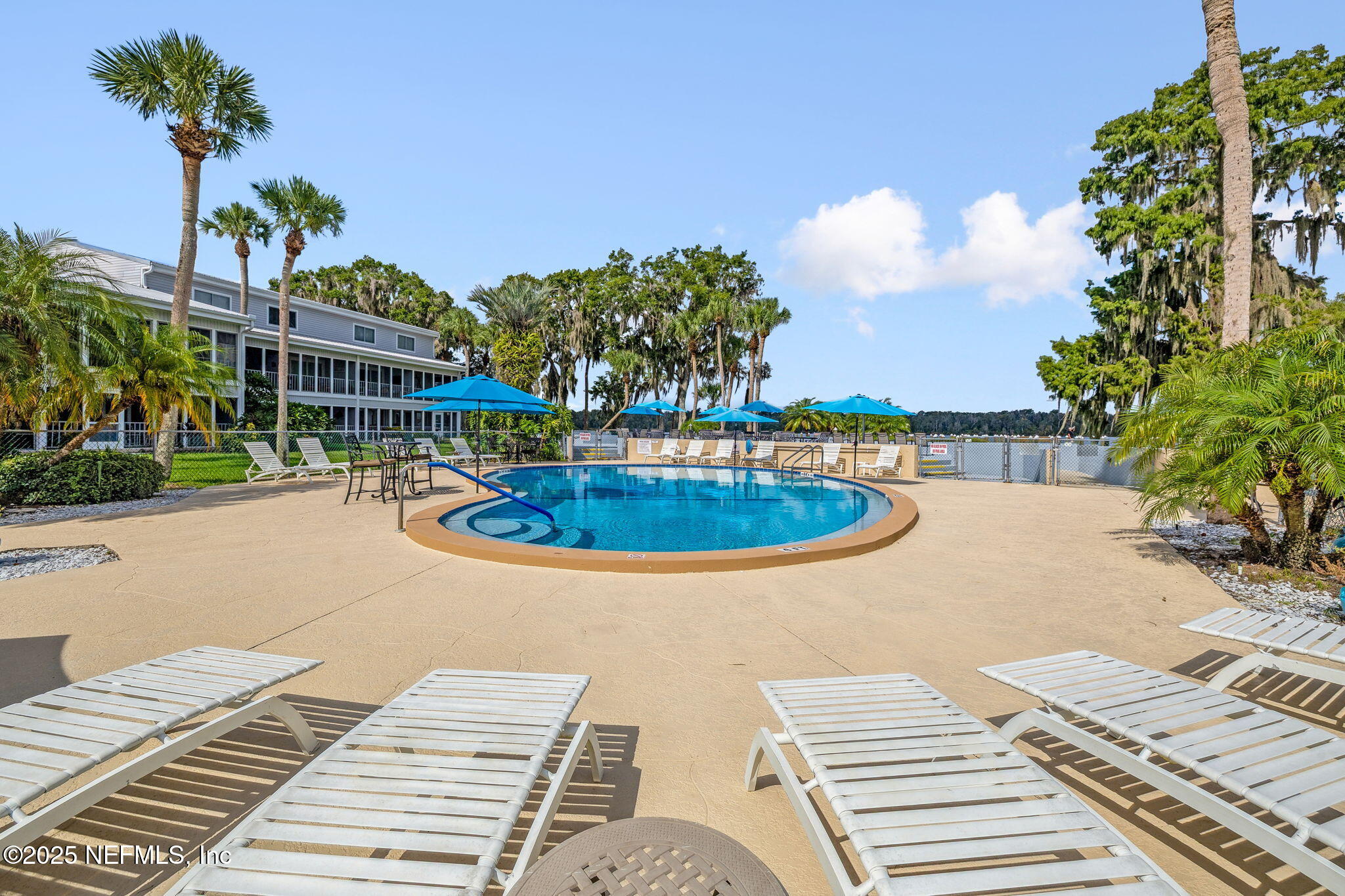 210 River Bend Court, Unit B Welaka, FL 32193 - Photo 26 of 41 a view of a swimming pool with a patio