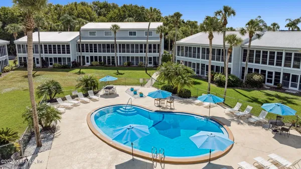 a view of a swimming pool with a patio