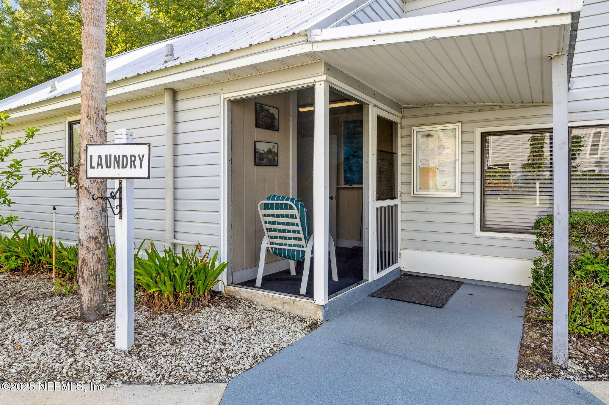 210 River Bend Court, Unit B Welaka, FL 32193 - Photo 29 of 41 a view of a house with porch