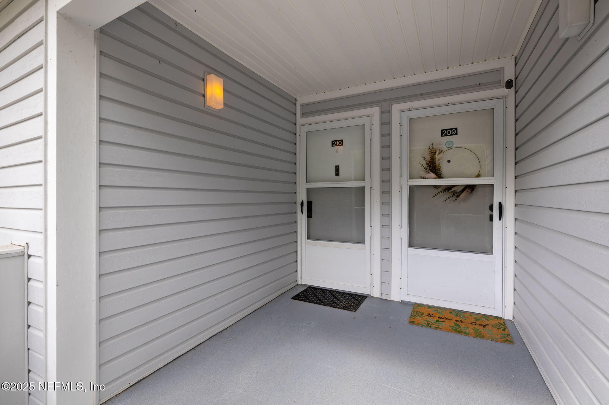 210 River Bend Court, Unit B Welaka, FL 32193 - Photo 3 of 41 a view of an entryway of the house