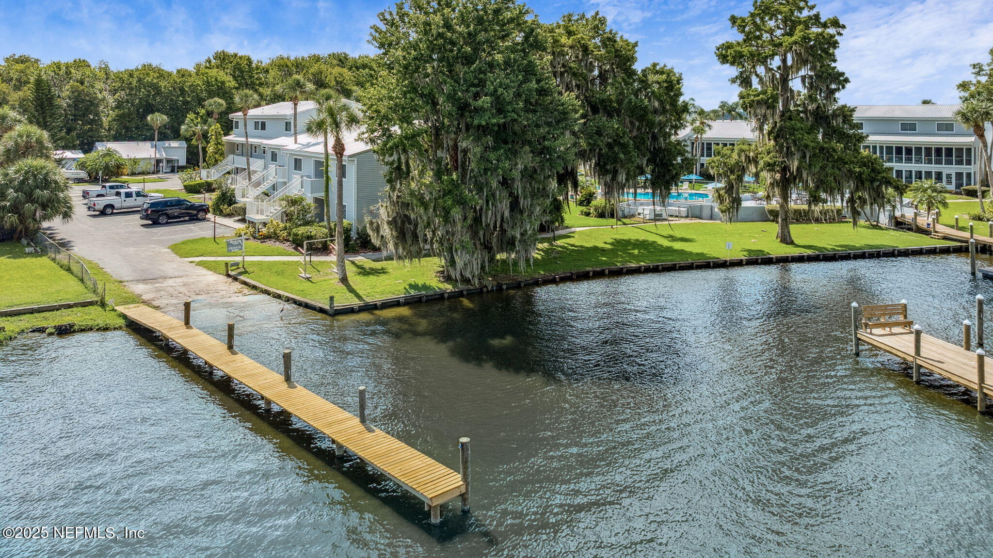210 River Bend Court, Unit B Welaka, FL 32193 - Photo 33 of 41 an aerial view of a house with swimming pool patio and lake view