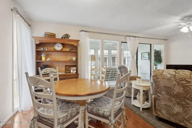 a bedroom with furniture and a flat screen tv