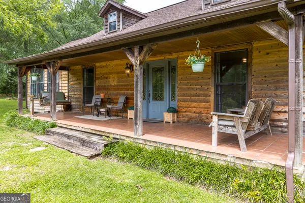 a view of a lounge chairs in the patio