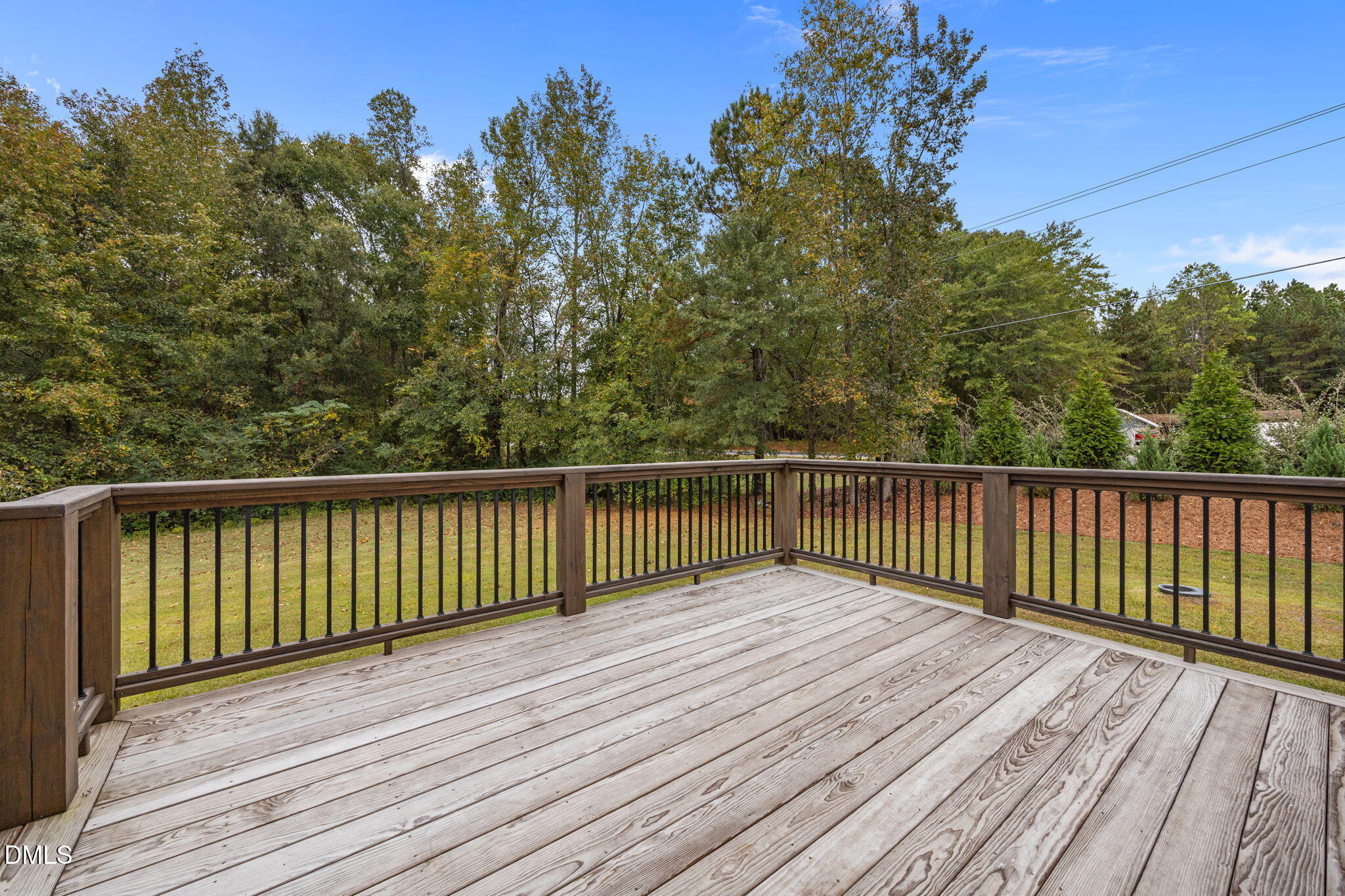 10 Carnation Road Youngsville, NC 27596 - Photo 38 of 47 a view of balcony with wooden floor and fence