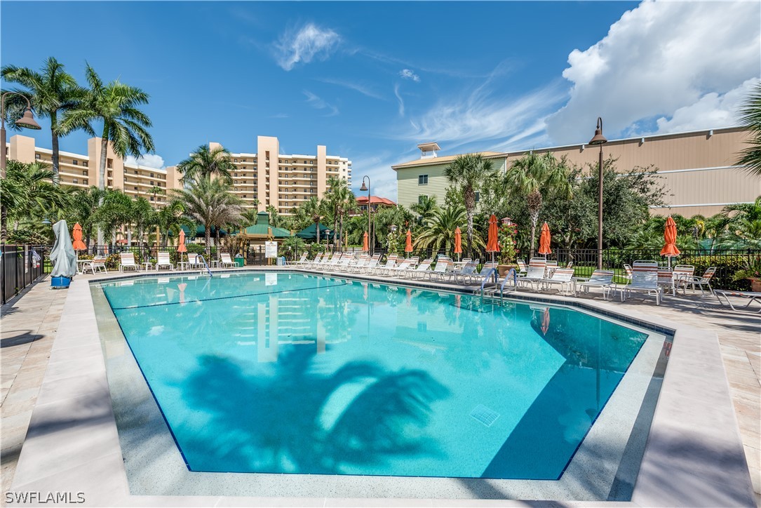 15021 Punta Rassa Road, Unit 201 Fort Myers, FL 33908 - Photo 18 of 29 a view of a swimming pool with a patio