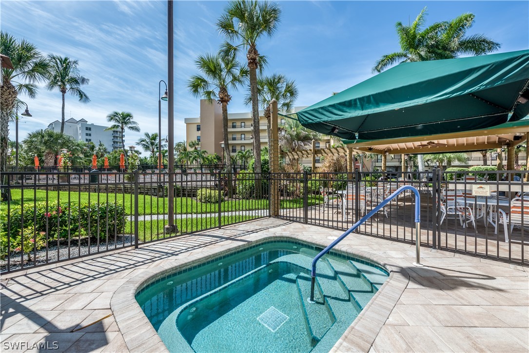 15021 Punta Rassa Road, Unit 201 Fort Myers, FL 33908 - Photo 19 of 29 a view of a backyard with a patio
