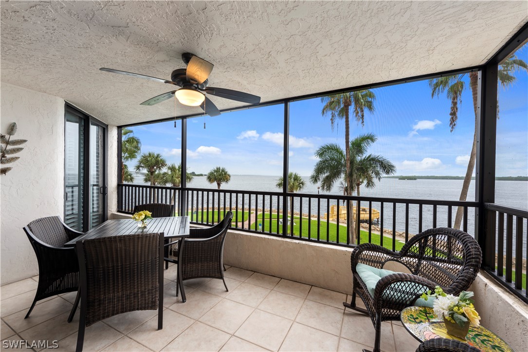 15021 Punta Rassa Road, Unit 201 Fort Myers, FL 33908 - Photo 2 of 29 a view of a chairs and table in patio