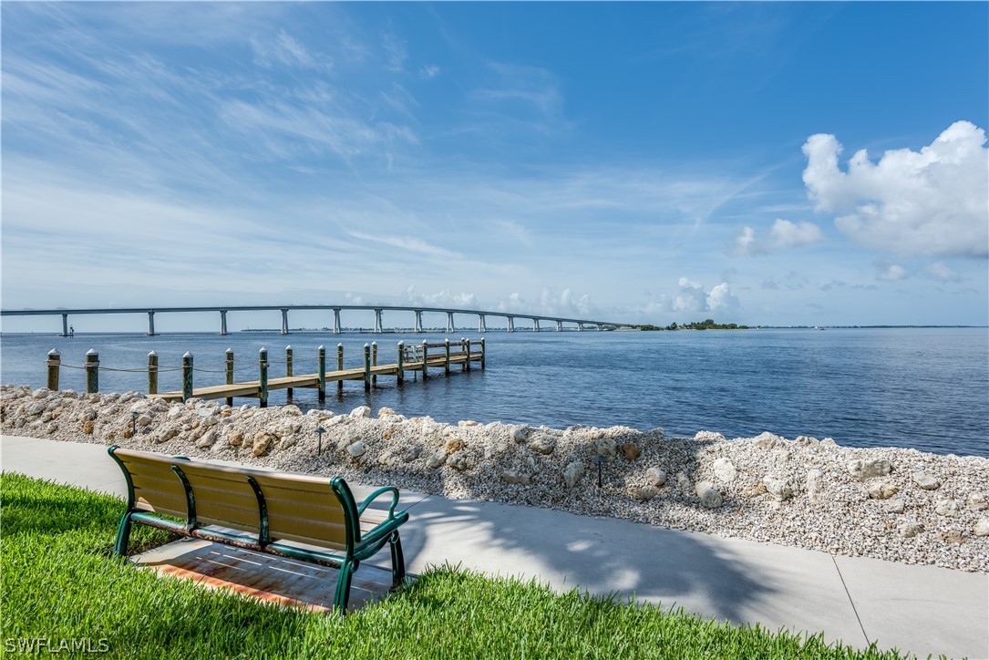 15021 Punta Rassa Road, Unit 201 Fort Myers, FL 33908 - Photo 21 of 29 a view of a swimming pool with a lounge chair