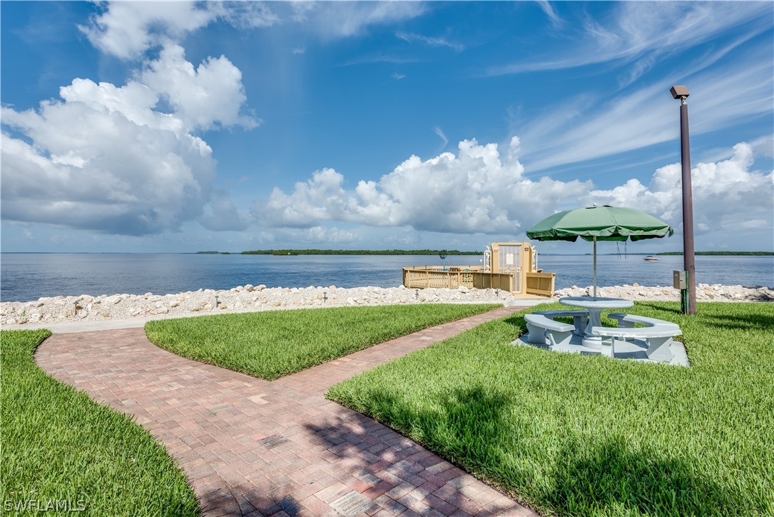 15021 Punta Rassa Road, Unit 201 Fort Myers, FL 33908 - Photo 22 of 29 a view of a golf course with a swimming pool