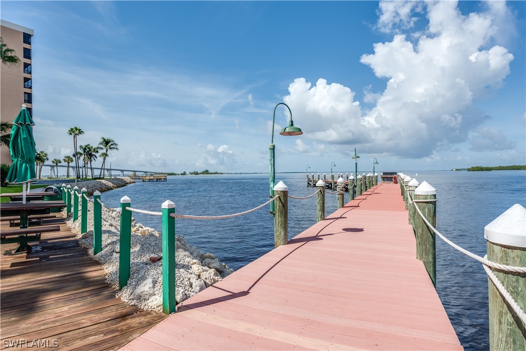 15021 Punta Rassa Road, Unit 201 Fort Myers, FL 33908 - Photo 23 of 29 a view of a balcony with two chairs