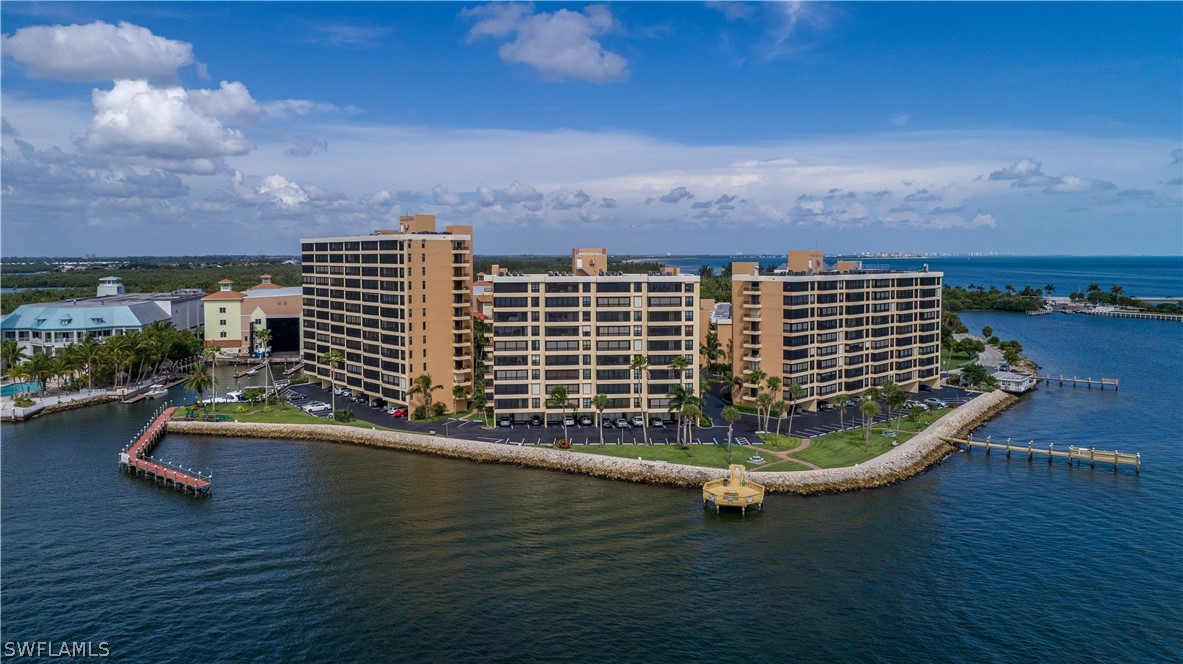 15021 Punta Rassa Road, Unit 201 Fort Myers, FL 33908 - Photo 24 of 29 a view of a city with tall buildings in the background