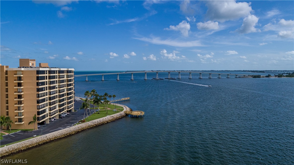15021 Punta Rassa Road, Unit 201 Fort Myers, FL 33908 - Photo 26 of 29 a view of a balcony with an outdoor space and seating area