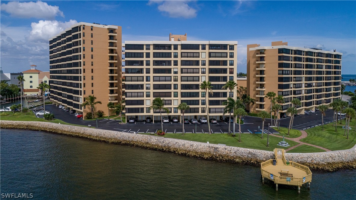 15021 Punta Rassa Road, Unit 201 Fort Myers, FL 33908 - Photo 28 of 29 a front view of a building with swimming pool