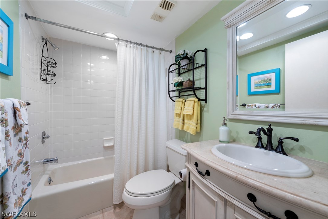 15021 Punta Rassa Road, Unit 201 Fort Myers, FL 33908 - Photo 10 of 29 a bathroom with a sink toilet and shower