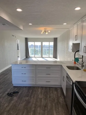 a bathroom with a sink and a large mirror