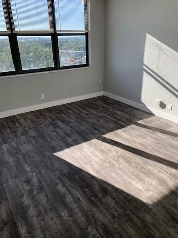 a view of an empty room with a window