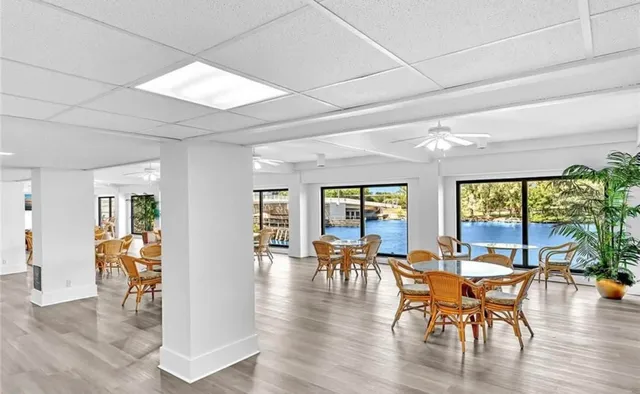 a view of a dining room with furniture window and outside view