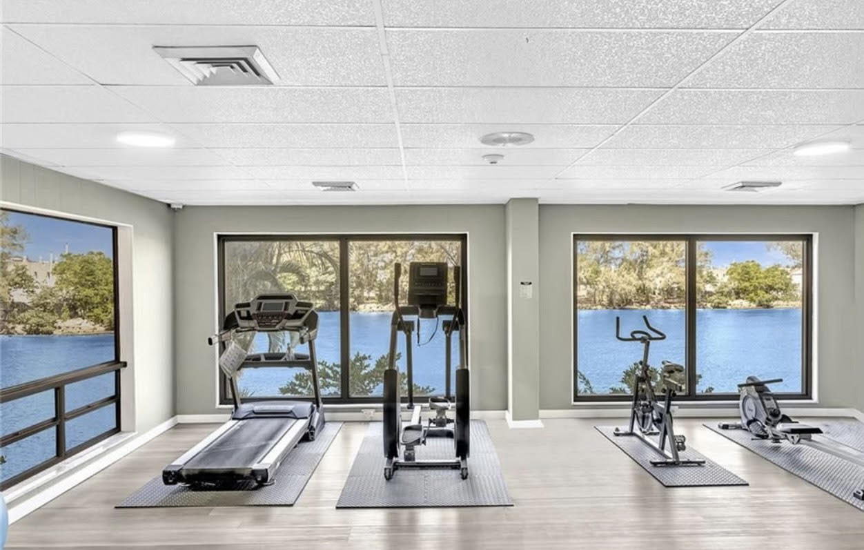 1401 North Riverside Drive, Unit 1205 Pompano Beach, FL 33062 - Photo 6 of 26 a living room with furniture and large windows