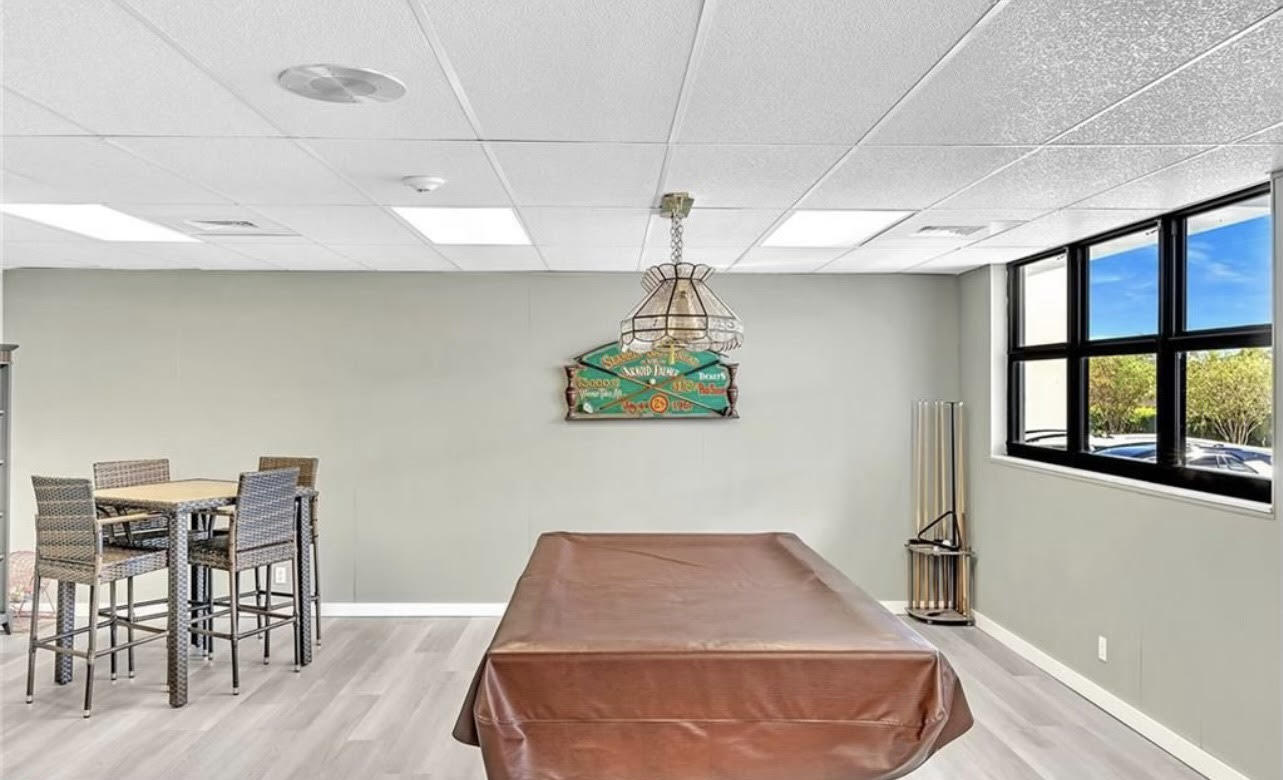 1401 North Riverside Drive, Unit 1205 Pompano Beach, FL 33062 - Photo 7 of 26 a room with furniture and window