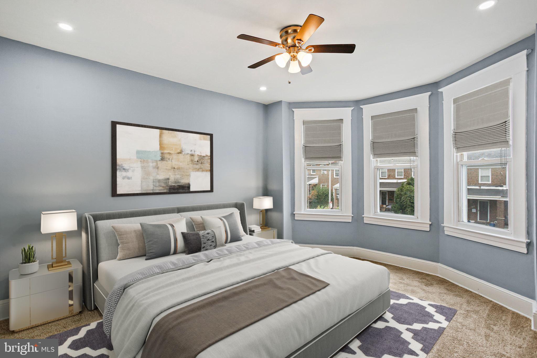 2811 Erdman Avenue Baltimore, MD 21213 - Photo 15 of 31 a bedroom with a large bed and a window