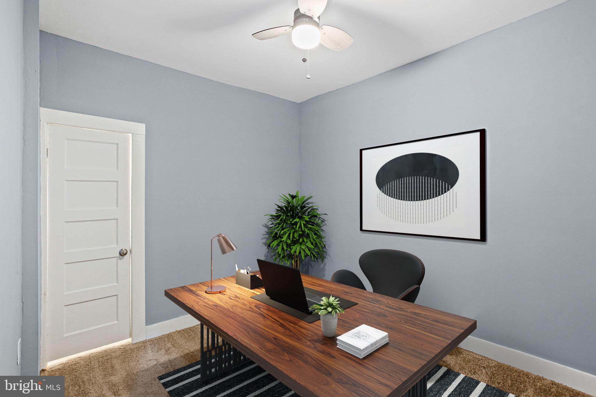 2811 Erdman Avenue Baltimore, MD 21213 - Photo 22 of 31 a view of a dining room with furniture and a potted plant