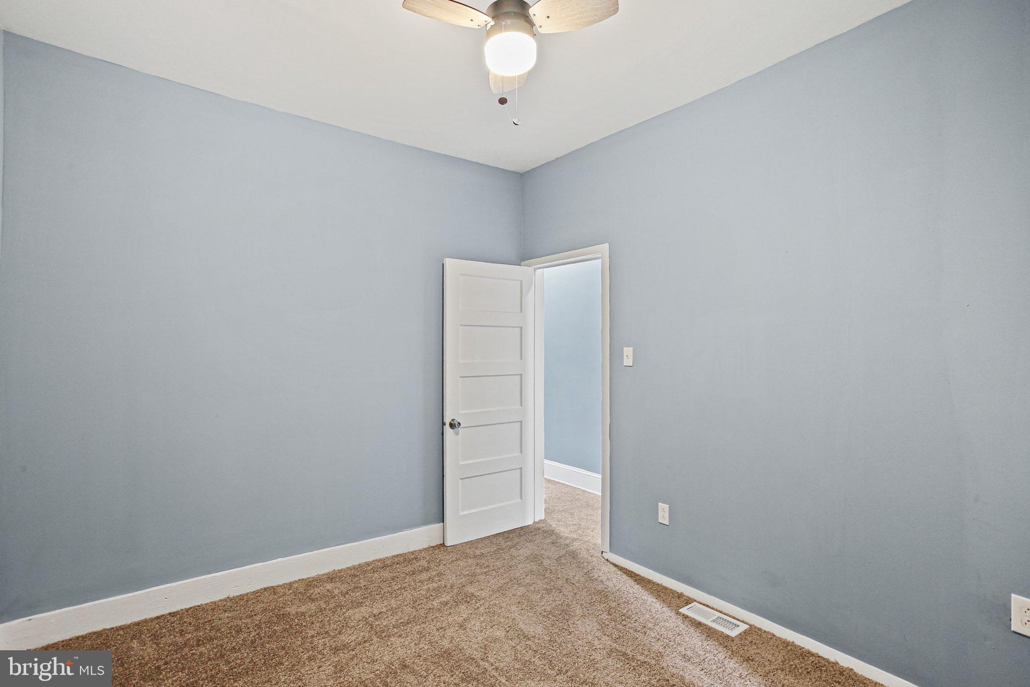 2811 Erdman Avenue Baltimore, MD 21213 - Photo 23 of 31 wooden floor in an empty room