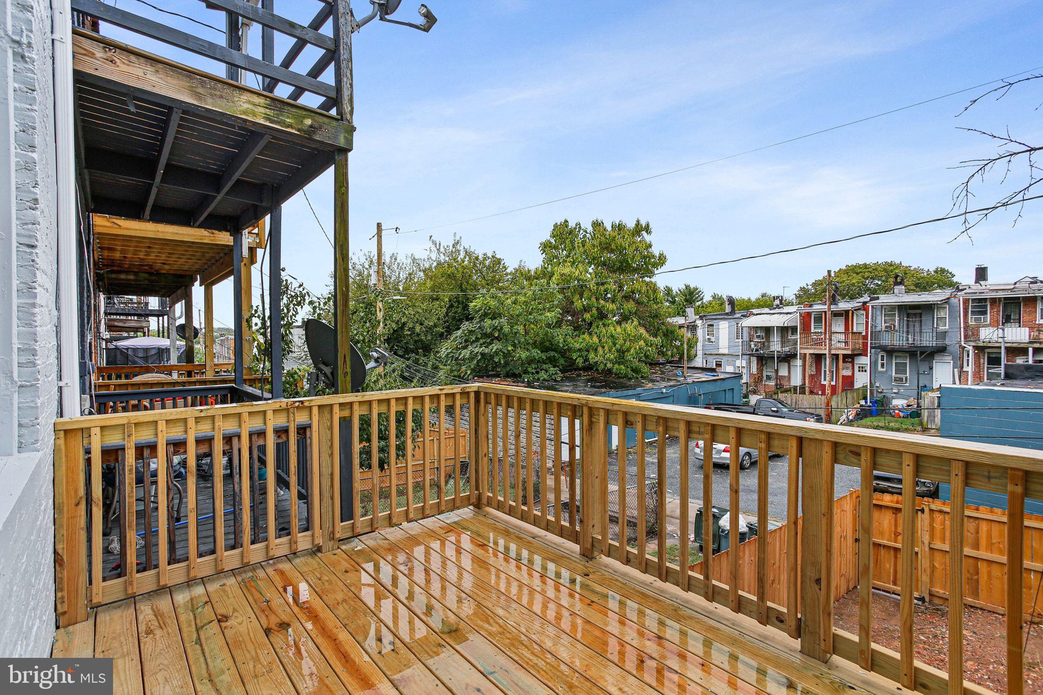 2811 Erdman Avenue Baltimore, MD 21213 - Photo 29 of 31 a view of a balcony with wooden floor