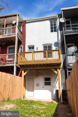 a view of a balcony with wooden floor