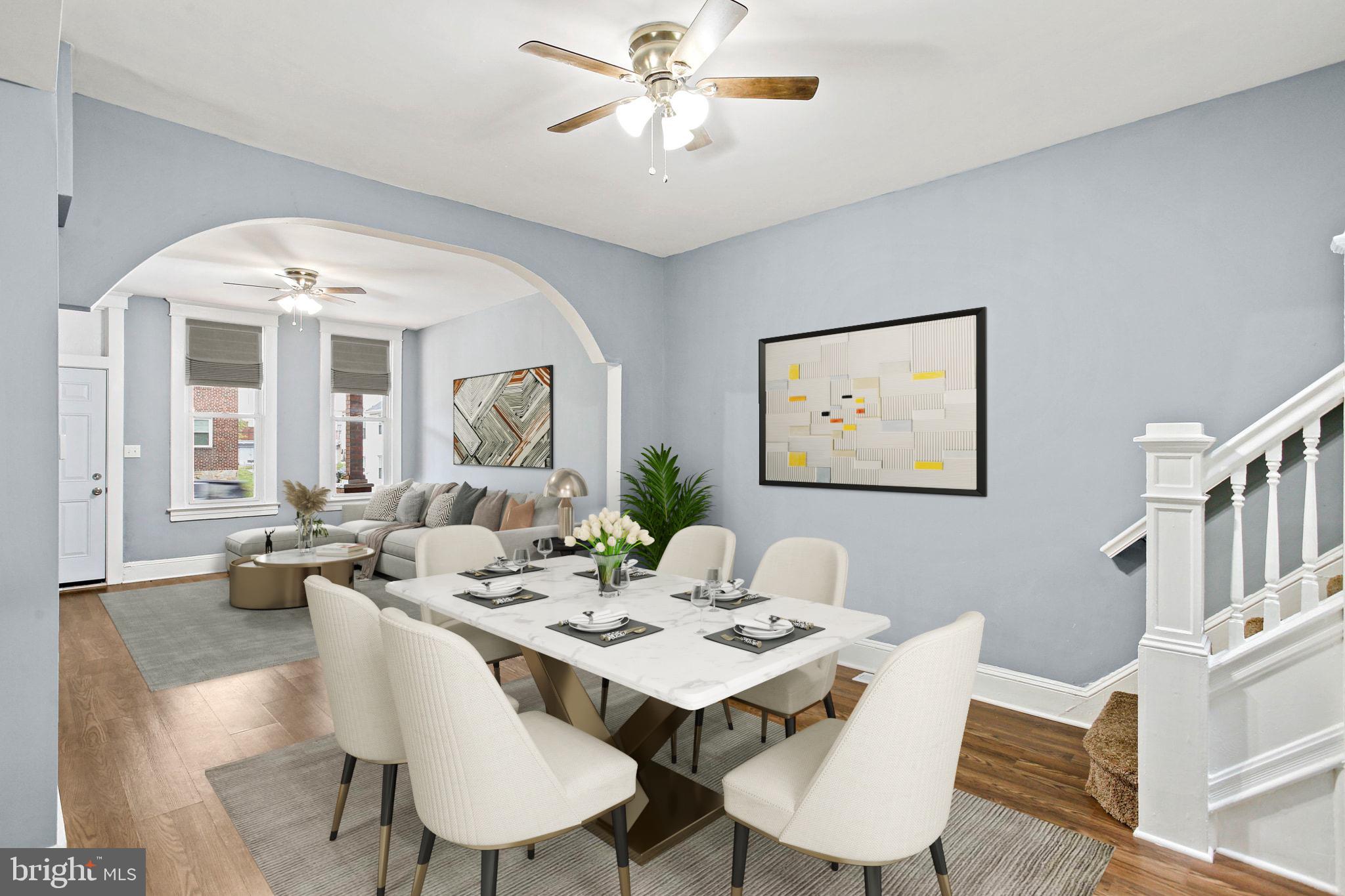 2811 Erdman Avenue Baltimore, MD 21213 - Photo 5 of 31 a view of a dining room with furniture large window and wooden floor