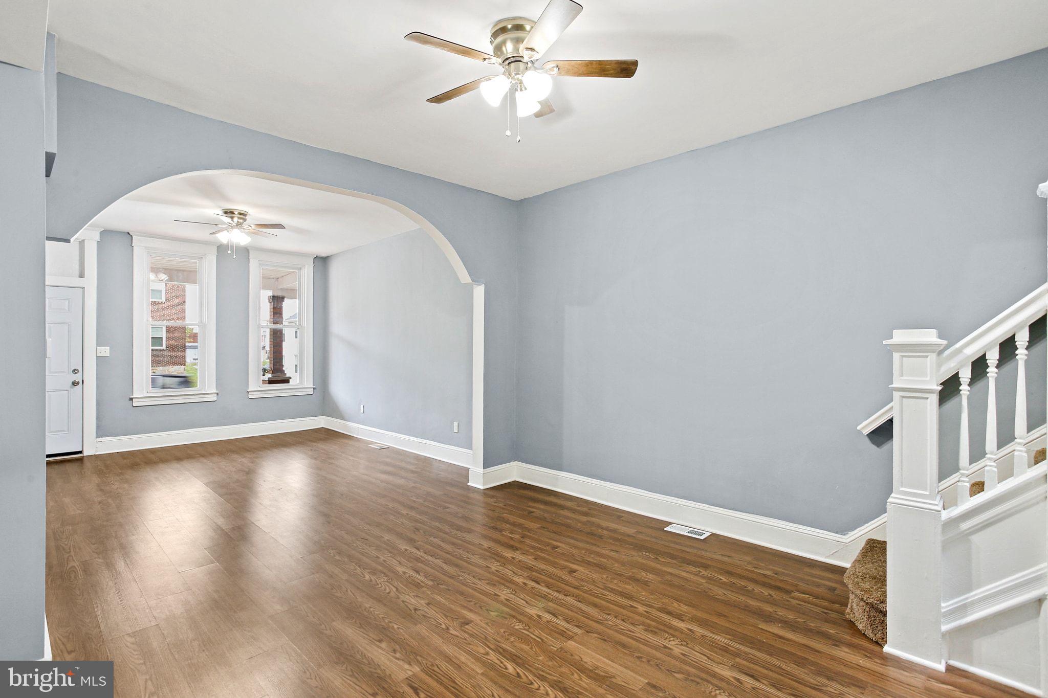2811 Erdman Avenue Baltimore, MD 21213 - Photo 8 of 31 wooden floor in an empty room with a window