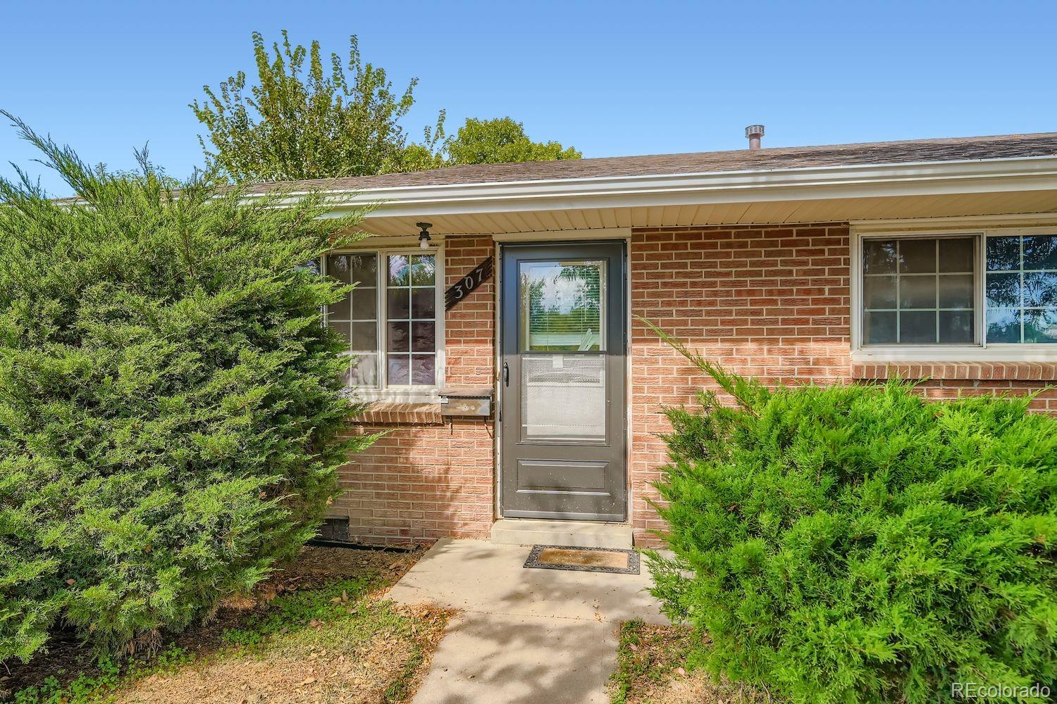 315 6th Street Fort Lupton, CO 80621 - Photo 5 of 26 front view of a house with a yard