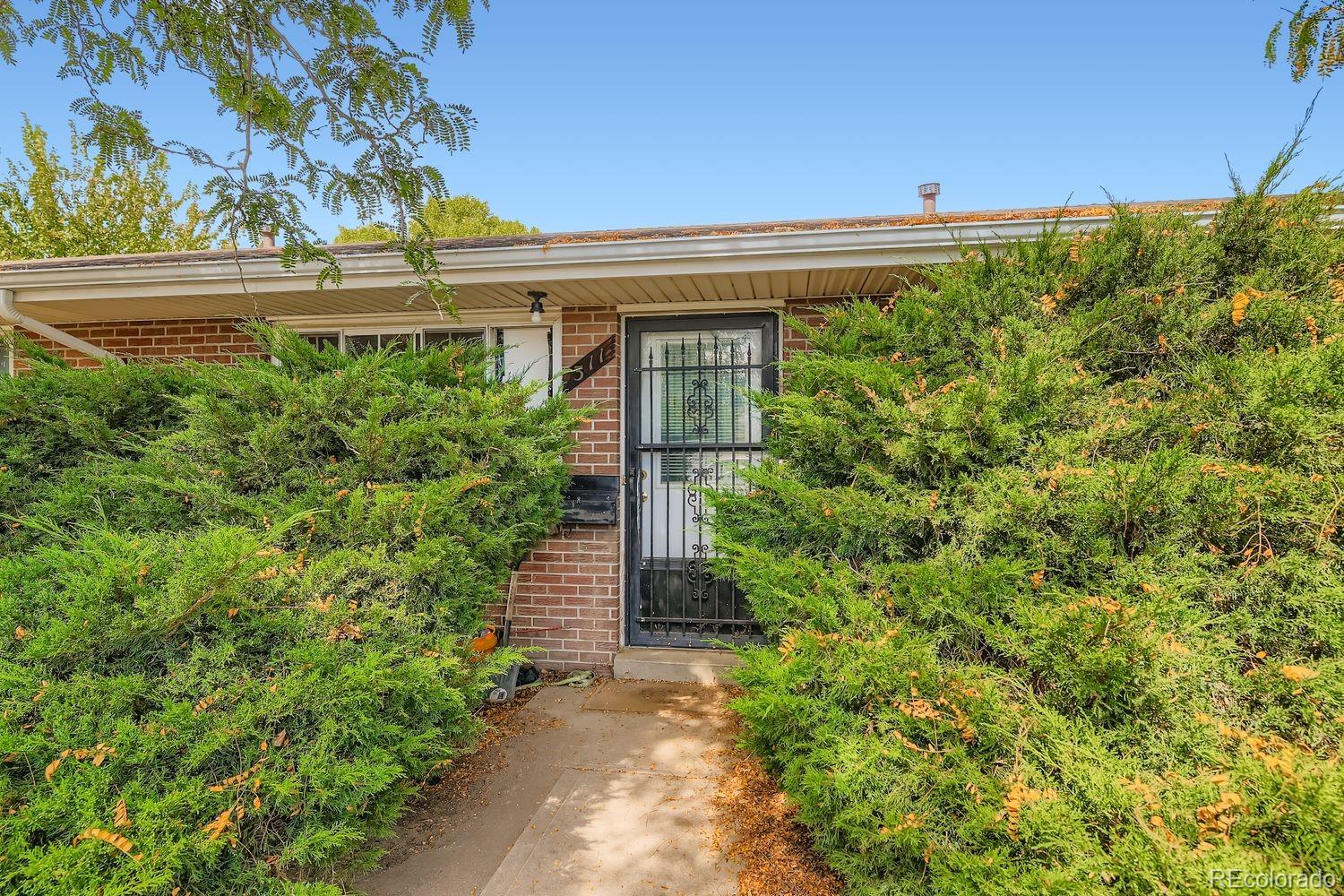 315 6th Street Fort Lupton, CO 80621 - Photo 7 of 26 a view of a pathway in outside of the house