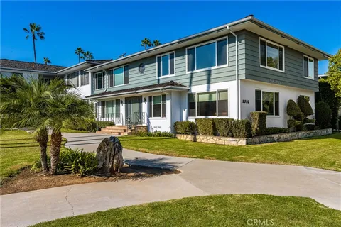a front view of a house with a yard table and chairs