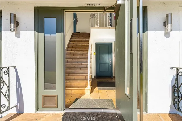 a view of a hallway with a living room