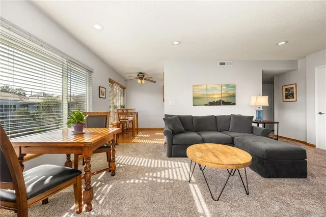 a living room with furniture and a table