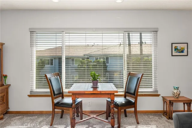 a dining room with furniture and windows