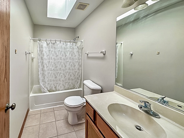 637 Deames Street Plano, IL 60545 - Photo 12 of 18 a bathroom with a sink a toilet and shower