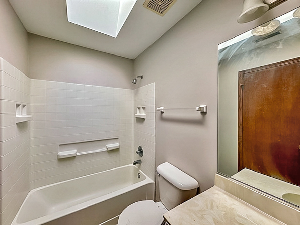 637 Deames Street Plano, IL 60545 - Photo 15 of 18 a bathroom with a toilet and a shower