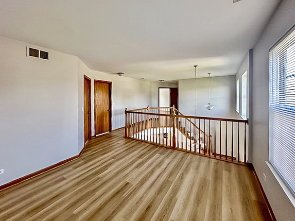 637 Deames Street Plano, IL 60545 - Photo 17 of 18 a view of a room with wooden floor fan and window