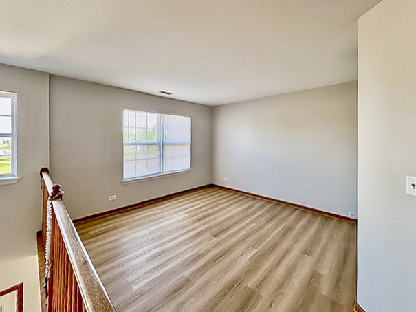 637 Deames Street Plano, IL 60545 - Photo 18 of 18 a view of an empty room with windows