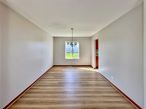 637 Deames Street Plano, IL 60545 - Photo 4 of 18 a view of an empty room and window