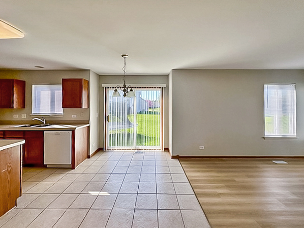 637 Deames Street Plano, IL 60545 - Photo 8 of 18 a view of kitchen with granite countertop cabinets a sink a counter top space and stainless steel appliances