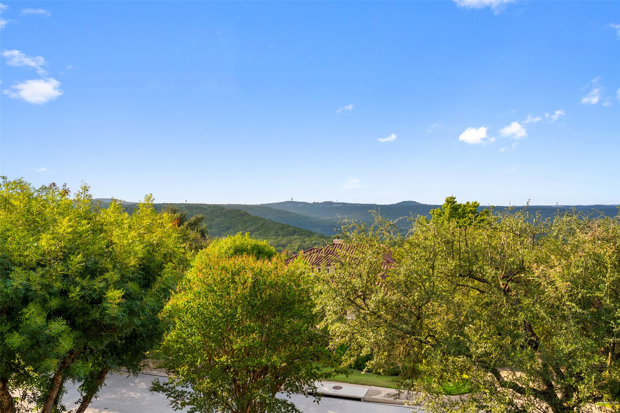 12027 Pleasant Panorama View Austin, TX 78738 - Photo 2 of 40 View - Hill country view from the upper level balcony, with glimpses of Lake Austin