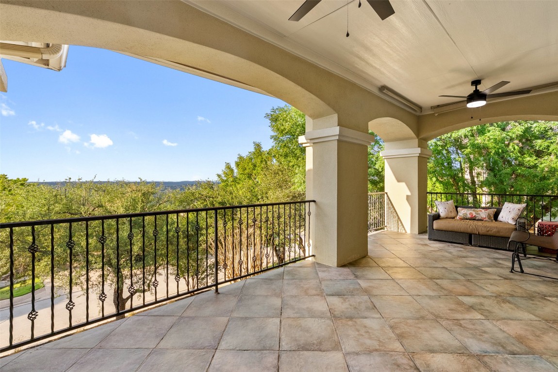 12027 Pleasant Panorama View Austin, TX 78738 - Photo 28 of 40 a view of a porch with furniture and a yard