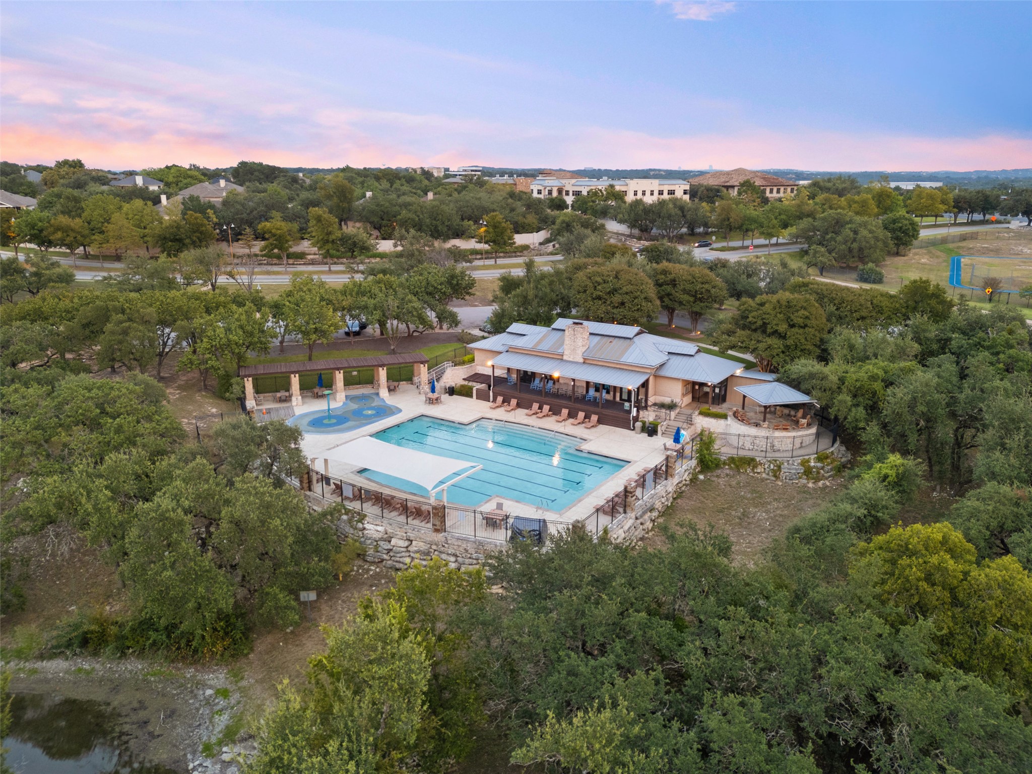 12027 Pleasant Panorama View Austin, TX 78738 - Photo 36 of 40 Community pool and clubhouse, along with nature trails and fishing dock on the lake
