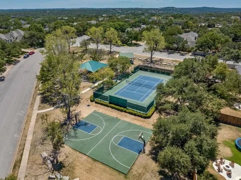 12027 Pleasant Panorama View Austin, TX 78738 - Photo 37 of 40 an aerial view of a house with a yard