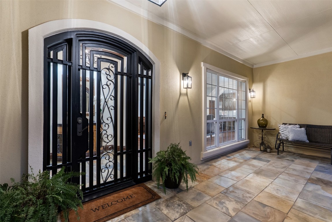 12027 Pleasant Panorama View Austin, TX 78738 - Photo 4 of 40 a view of front door and porch with wooden floor