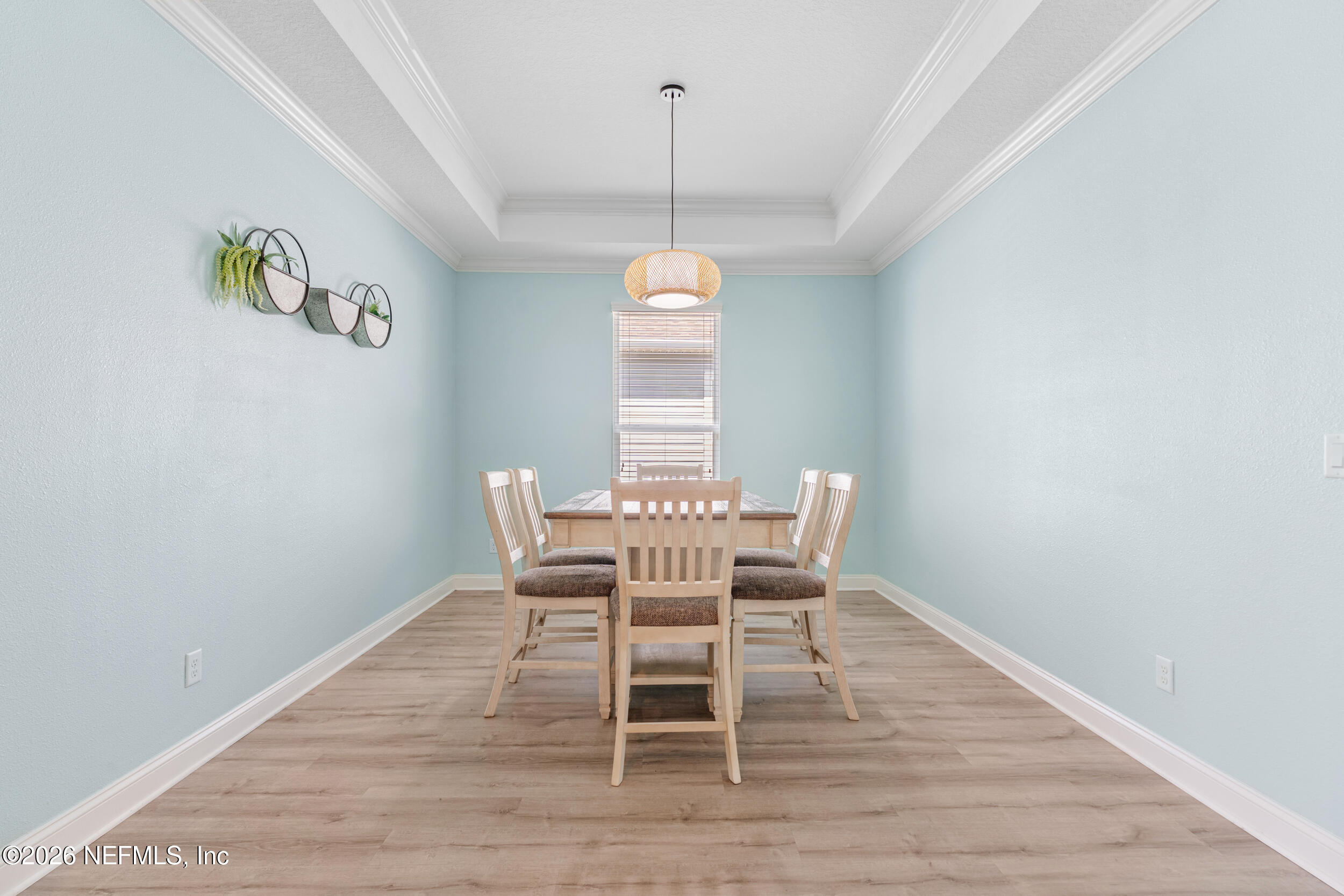 168 St Kitts Loop St. Augustine, FL 32092 - Photo 14 of 47 a dining room with a table and chairs