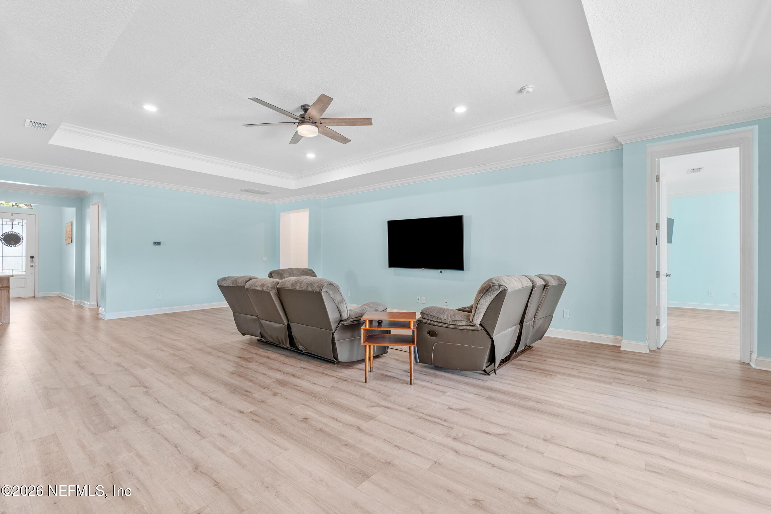 168 St Kitts Loop St. Augustine, FL 32092 - Photo 16 of 47 a living room with furniture and a flat screen tv
