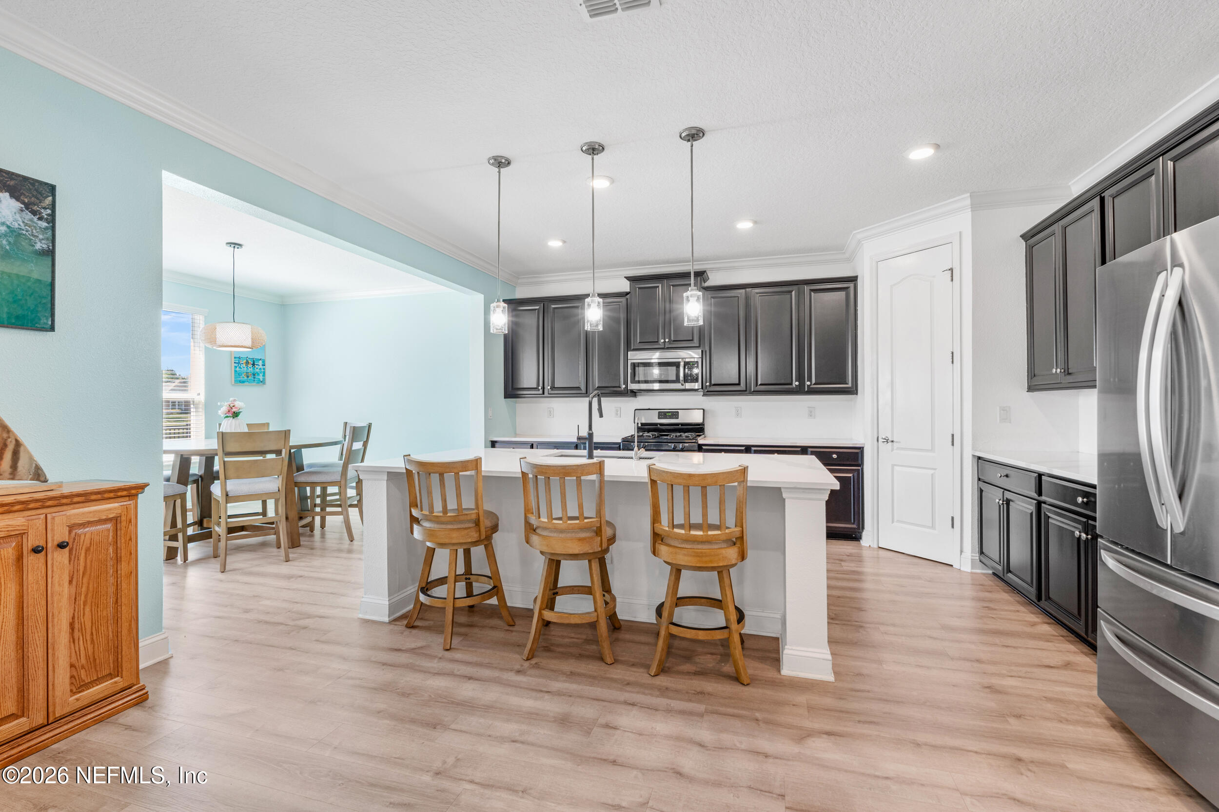 168 St Kitts Loop St. Augustine, FL 32092 - Photo 18 of 47 a large kitchen with a table and chairs